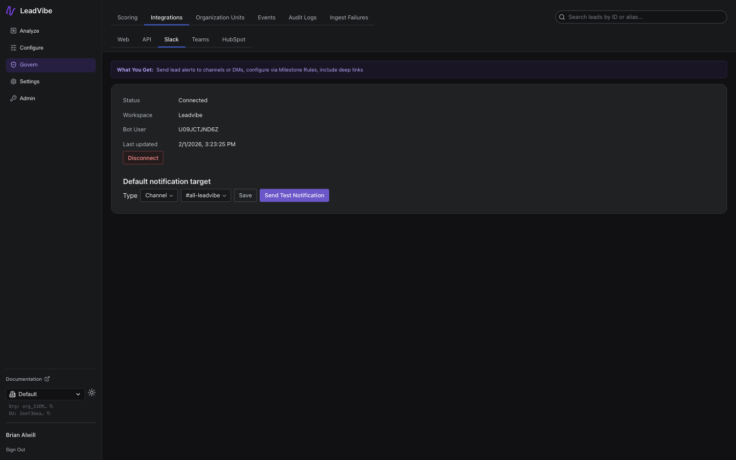 Slack integration settings page showing connected status, workspace name, bot user ID, last updated timestamp, Disconnect button, and default notification target with channel selector and Send Test Notification button
